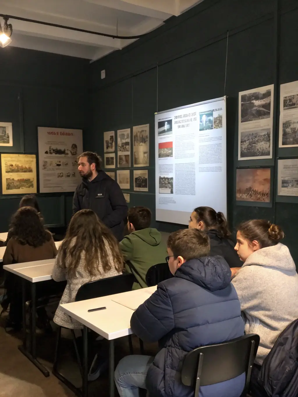 An image of students engaged in a group discussion, analyzing a documentary film about the Holocaust, representing the documentary storytelling module.